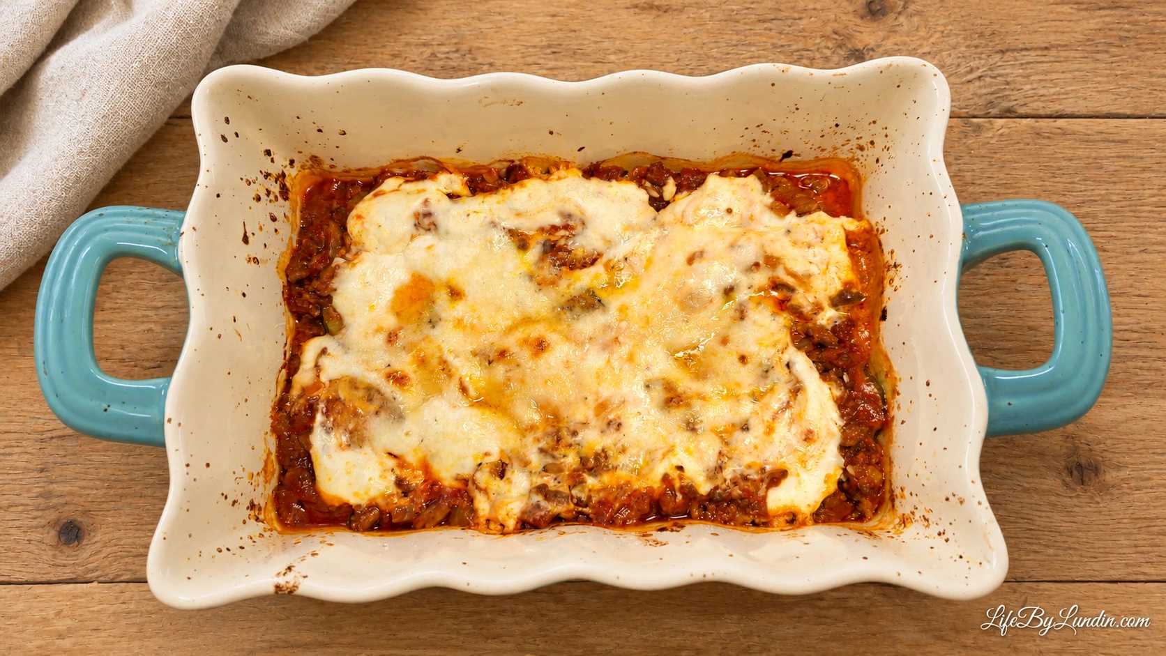 Courgette and mince bake with tomato, cheese and rice